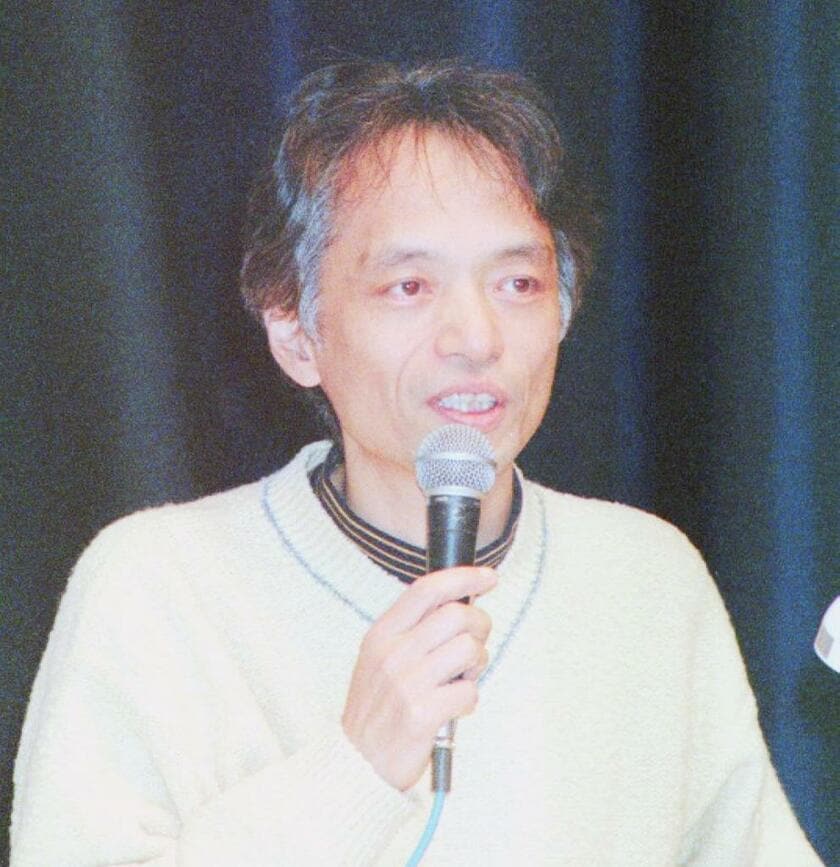 「国際環境技術フォーラム」で話す山本コウタローさん（1997年12月6日）