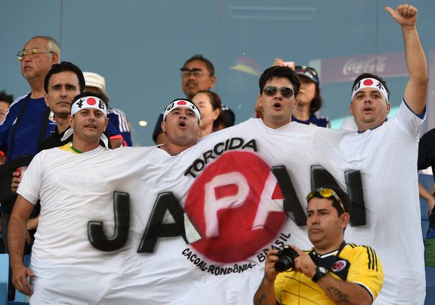 サッカーW杯ブラジル大会（2014 World Cup）グループC、日本対コロンビア戦の応援に訪れた日本のサポーター（2014年6月24日撮影）。(c)AFP＝時事/AFPBB News
<br />記事「W杯コロンビア戦で声援送る日本のサポーター」より
