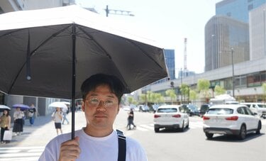 東京都心で「日傘男子」が急増中　直撃ルポでわかった「帽子じゃダメな理由」と「女性からの評判」