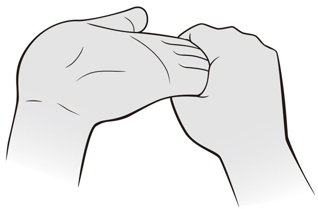 指ヨガで快眠息をゆっくり吐きながら、人さし指から小指までの４本の指をつかんで手首までグーッと反らせる。